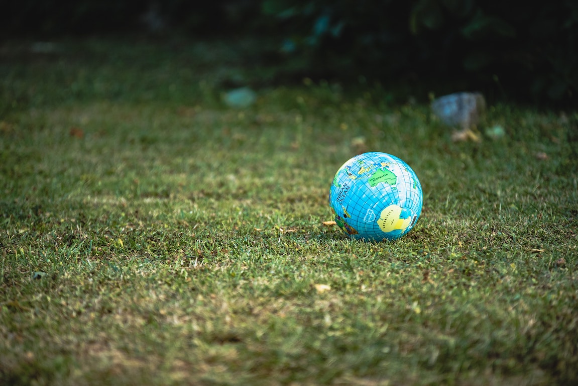 Mini globe resting on a lawn
